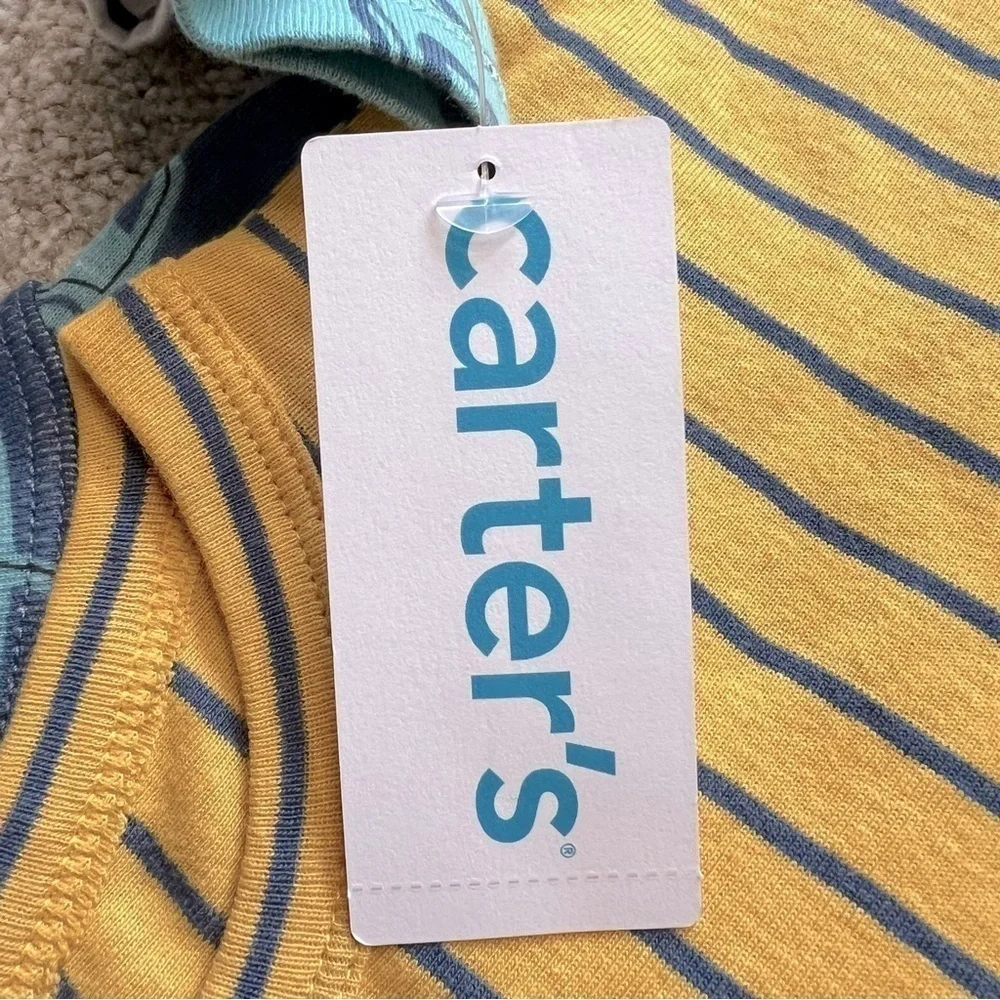 NWT Carter’s baby size 9 months four pc. Long sleeve onesies